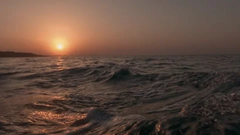 Low angle sea-level pov from sailing boat at sunset Video stock 278946882