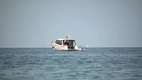 Low angle, sea-level view of people enjoying on small yacht Stock Footage 162041633