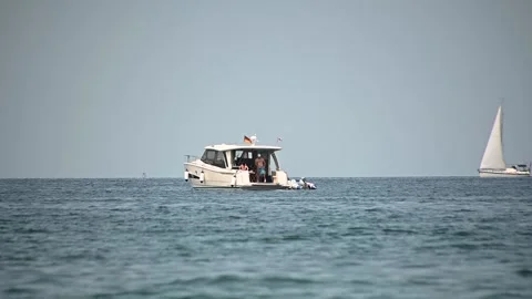 Low angle, sea-level view of people enjoying on small yacht Stock Footage 162041664