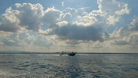 Low-angle sea-level view of motorboat navigating on sea water Видео 279865453