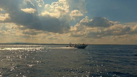 Low-angle sea-level view of motorboat running on sea water Stock Footage 279865564