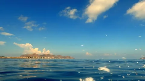 Low angle sea level view from boat spraying water at Favignana island Vidéo 279868396