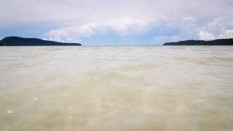 Low angle of sea water on the beach Stock-Footage 76553994