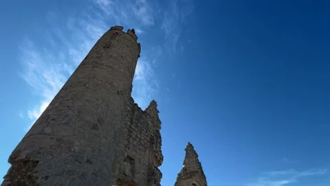 Low angle semi orbital shot of ruined castle of Caudilla, Toledo silhouette Stock Footage 333603554