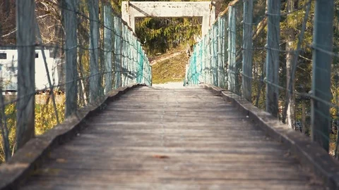 Low angle shaking rope suspension walking bridge Stock Footage 120033960