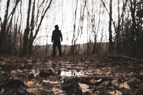 A low angle, shallow depth of field of a spooky blurred hooded figure. Foto stock