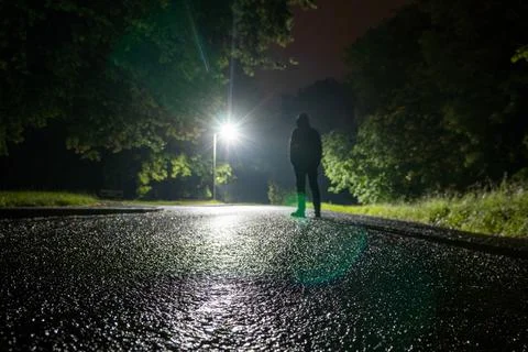 A low angle, shallow depth of field of a spooky hooded figure Stock Photos