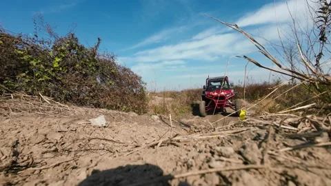 Low angle shoot of a 4x4 utv car climbing the rock Stock Footage 196966844