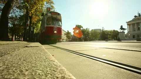 Low angle shooting of the tram crossing the sun in Vienna Stock-Footage 21249689