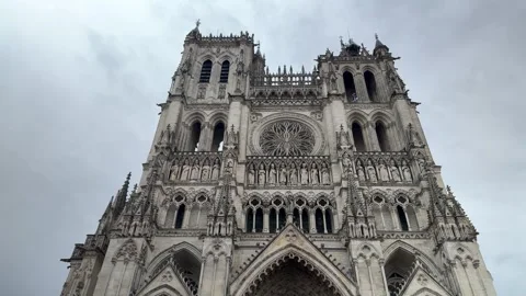 Low Angle Shot of Amiens Cathedral Facade in France on a Cloudy Day Stock Footage 346409208