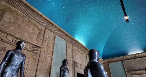 Low angle shot of ancient Egyptian sculptures under a blue starry ceiling Stock-Footage 339995557