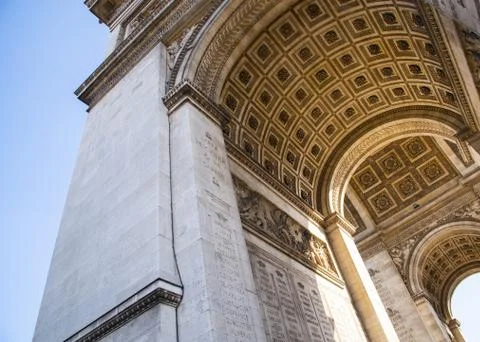 Low angle shot of Arc de Triomphe under the sunlight in Paris, France Stock Photos
