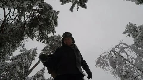 Low angle shot of backpacker slinging his rucksack and preparing for a hiking Stock Footage 145954094