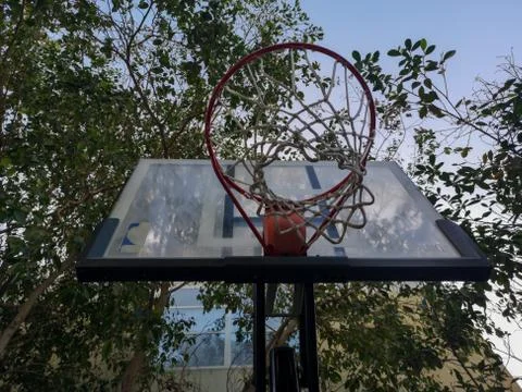 Low angle shot of a Basketball structure (rim) in an outdoor playground Stock Photos