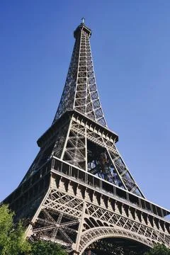 Low angle shot of the beautiful Eiffel Tower against the blue sky 写真素材