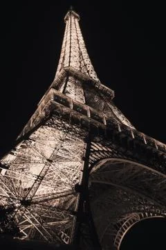 A low angle shot of beautiful glowing lights of Eiffel Tower in Paris, France Stock Photos