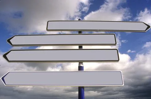 Low angle shot of blank directional signs Stock Photos