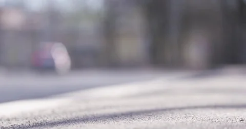 Low angle shot of blurred car traffic in sunny spring day Stock Footage