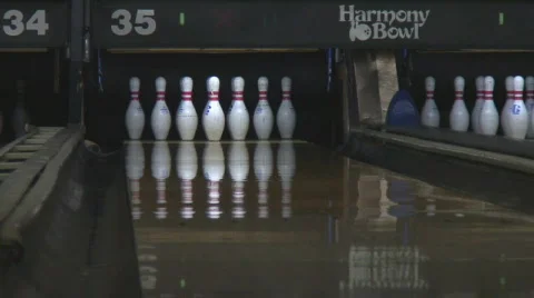 Low angle shot of bowling ball knocking down pins Stock Footage 133797