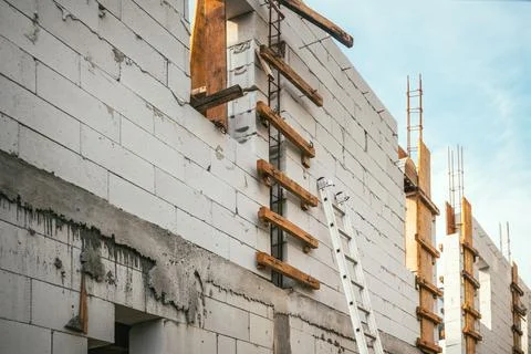 Low-angle shot of a building under construction, showing aerated concrete A.. Stock Photos