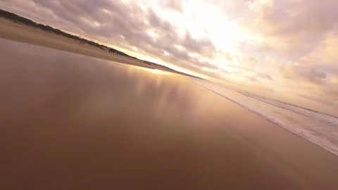 Low angle shot captures reflective sand Stock Footage 344543195