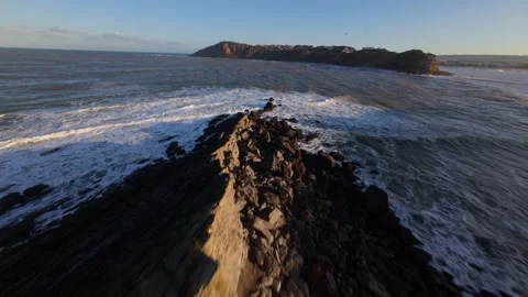 Low-angle shot captures sun reflecting on textured water surface Stock Footage 344580938