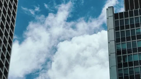 A low-angle shot captures the towering modern architecture of Hong Kong's Stock Footage 338317531
