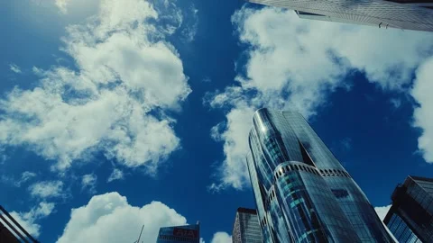 A low-angle shot captures the vibrant skyline of Hong Kong with modern Video stock 338311559