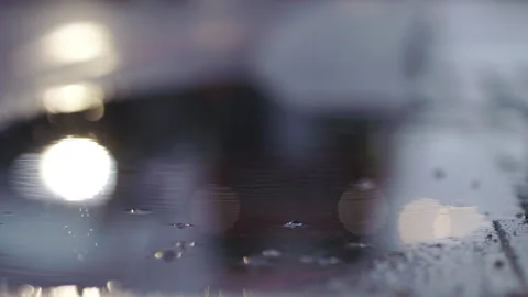 Low Angle Shot Of Car Passing In Melancholic, Gloomy, Rainy Morning Stock Footage 255281309