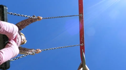 Low angle shot of child in swing Stock Footage 65110766