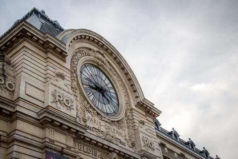 Low-angle shot of the clock of Paris-Orleans building, Paris, France Stock Photos