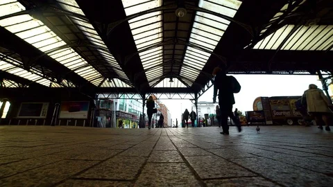 Low angle shot of commuters and tourists at Brighton station Stock Footage 84899826
