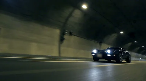 Low angle shot of Corrvete driving by Stock Footage 33004155