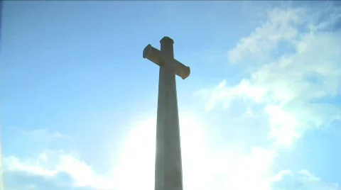 Low angle shot of a cross with Clouds timelapsing in the background Stock Footage 608834