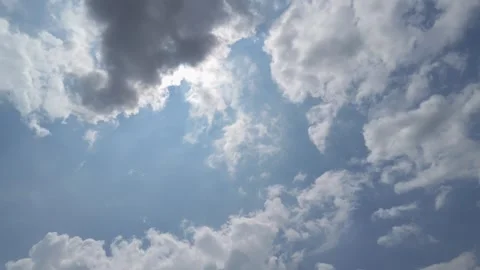 Low-angle shot, cumulus clouds in a blue sky. Video stock 341776670