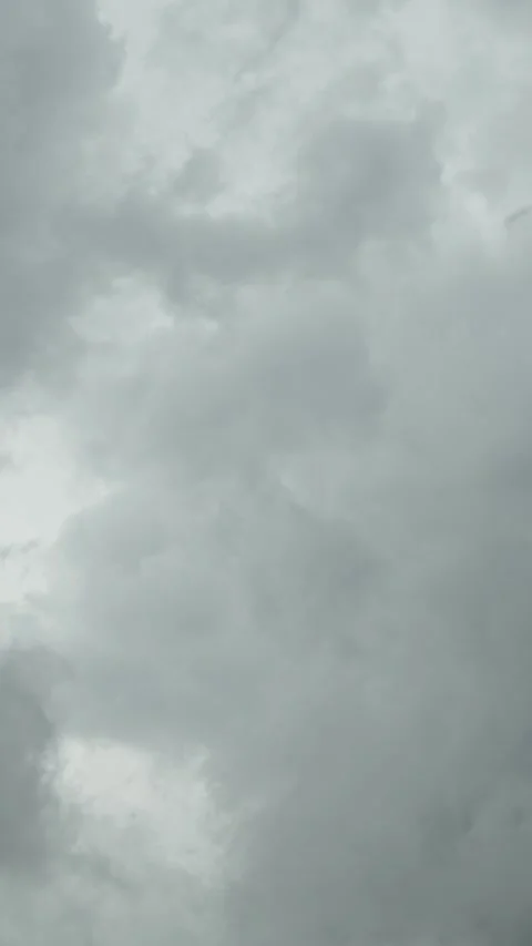 A low-angle shot of dark, heavy storm clouds gathering Stock Footage 340817950