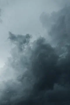 A low-angle shot of dark, heavy storm clouds gathering Stock Photos
