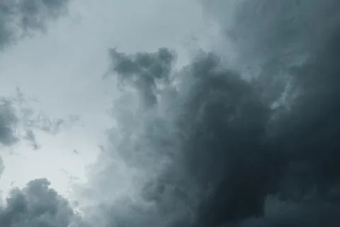 A low-angle shot of dark, heavy storm clouds gathering Stock-Fotos