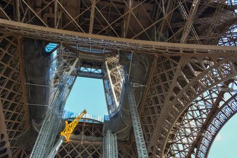 Low angle shot of Eiffel Tower, Paris, France first floor metal with blue clear 스톡 사진