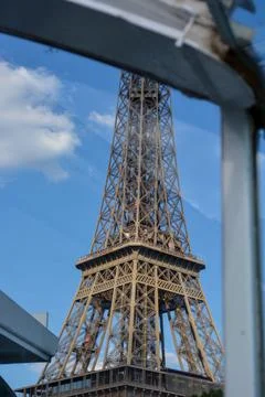 Low angle shot of the Eiffel Tower, Paris, France behind a transparent glass 스톡 사진
