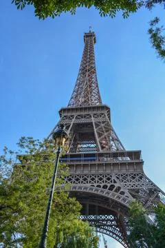 Low angle shot of the Eiffel Tower, Paris, France with blue clear sky with a Stock Photos