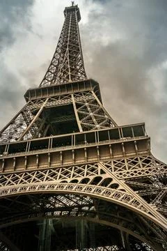 Low-angle shot of the Eiffel Tower on a cloudy day in Paris Stock Photos