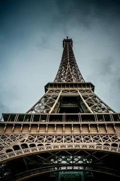 Low-angle shot of the Eiffel Tower on a cloudy day in Paris Stock Photos