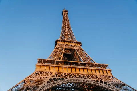 Low angle shot of the Eiffel Tower in Paris, France at golden hour 스톡 사진