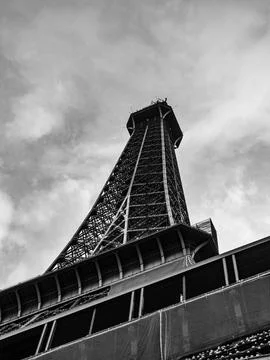 Low-angle shot of the Eiffel Tower in Paris, France on a cloudy day Stock Photos