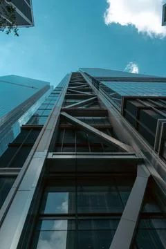 Low angle shot of the facade of a modern offices building under blue sky Fotos de archivo