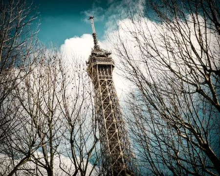 A low angle shot of the famous Eiffel Tower in Paris, France under a beautifu Stock Photos