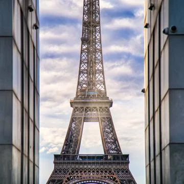 Low angle shot of the famous Eiffel Tower in Paris, France under a cloudy sky Stock Photos