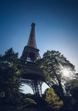Low angle shot of the famous Eiffel Tower in Champ de Mars in Paris, France Stock Photos
