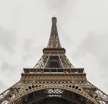 Low angle shot of Famous Eiffel tower iron structure with white sky backgroun 스톡 사진